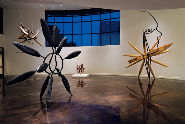 James Surls (born 1943), from left to right: Angel and the Blades, 1988. Oak, pine, and steel. Gift of Donald and Barbara Zale in honor of George and Julie Tabolowsky; Outdoor Walking Flower, 1986. Oak and steel. Gift of Dr. Mark Parker; Me as Walking Eye, 1985. Oak, pine, and steel. Gift of Jean W. Bush in memory of Gerald W. Bush; Me, Knife, Diamond and Flower, 1999. Pine, poplar, and steel. Gift of John Alexander.(Photo by J. Griffis Smith)