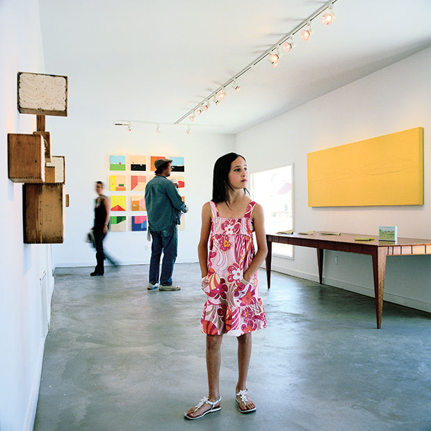 No stranger to the Marfa art world, Camille Willaford surveys her parents’ gallery, Galleri Ur­­­bane. On display (from left): works by Kate Carr, Gail Perter Borden, and co-owner Jason Willaford.