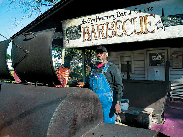 Working barbecue magic in the pits at Huntsville's New Zion Missionary Baptist Church. (Photo by John DeMers)