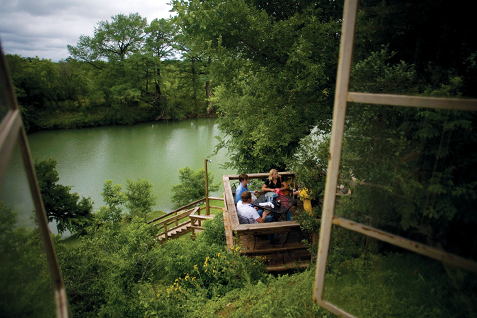  A deck at Dave’s Place in Center Point provides a pleasant promontory next to the Guadalupe. (Photo by Julia Robinson)