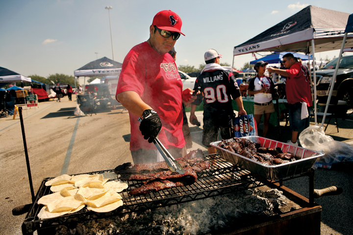 Tailgating in Texas is not just a casual, snacks-for-friends-only affair: These cooks often feed hundreds of fans. (Photo by Paul S. Howell)