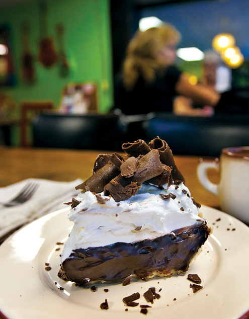 Topped with whipped cream and a generous sprinkling of chocolate shavings, the chocolate cream pie at Kyle's Texas Pie Company takes dessert to new heights. (Photo by Alberto Martinez)