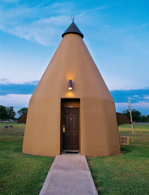 When Barbara and Bryon Woods won the Texas lottery, they invested their winnings in renovating the 10 stucco teepees of Wharton’s Teepee Motel, which dates to 1942. (Photos by J. Griffis Smith)