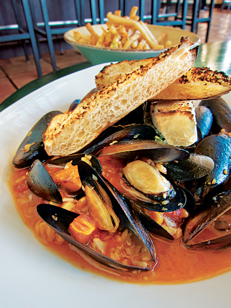 The classic combination of mussels and fries shines at the Holland Hotel's new Century Bar & Grill.