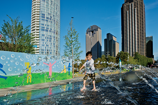 The splash pad at Dallas’ new Klyde Warren Park is a big draw for children.