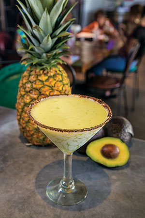If You Like Piñacate Served in a martini glass rimmed with chile and salt, the Piñacate features a mix of tequila, citrus, pineapple, and avocado.