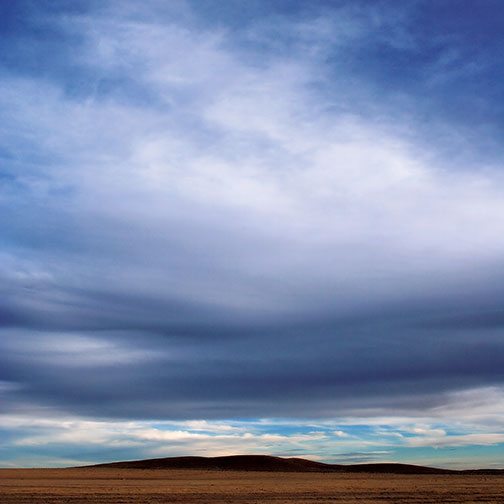 Wind currents buffet clouds above the high desert grasslands just east of Marathon. Photo © E. Dan Klepper