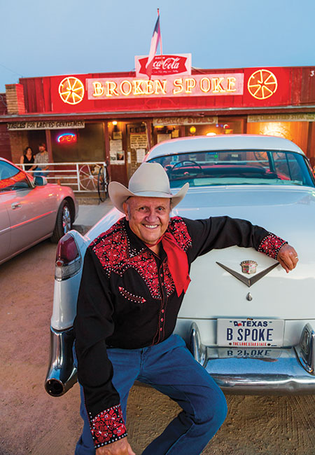 James White, owner of the Broken Spoke, with his 1954 Cadillac Coupe de Ville in front of the honky-tonk and restaurant on South Lamar in Austin.