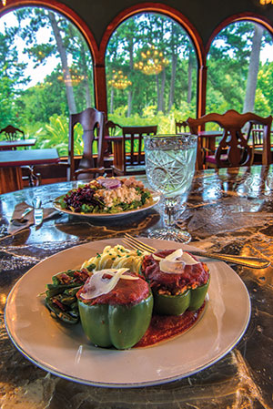 Larry Bruce Gardens grows fresh produce for the onsite restaurant, where  he and his wife, Sara, serve a buffet lunch in a bright dining room with broad windows  overlooking the gardens.