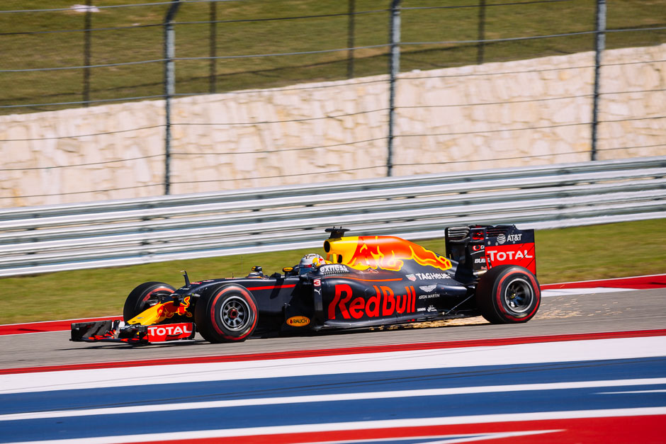 Red Bull Racing's Daniel Ricciardo leaving some sparks in his wake approaching turn 19 during qualifying.