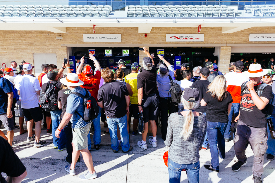 Fans crowding around the garages of their favorite teams during Friday's pit lane walk.
