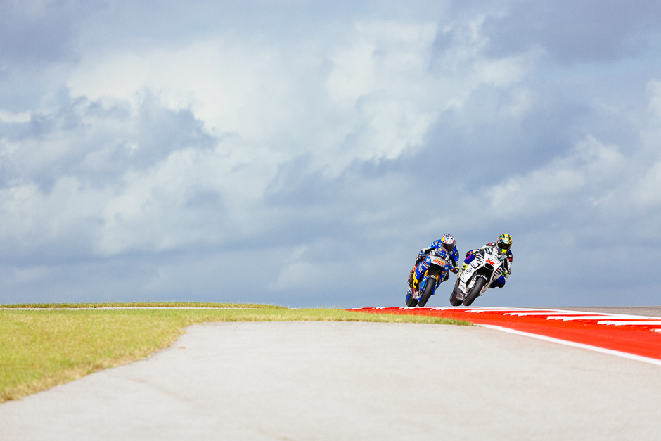 Karel Abraham and Jack Miller crest the hill at turn 10 during the first MotoGP practice session under cloudy skies on Friday morning.