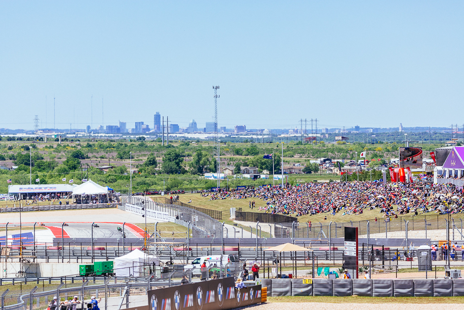 A view of the Austin skyline from the hill at turn one as the riders head through turn 19 during the race.