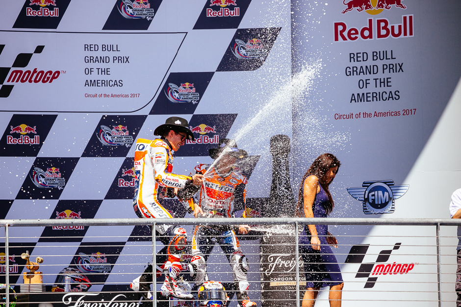 The winners spraying each other, and anyone in their proximity with champaign at the end of the podium ceremony.