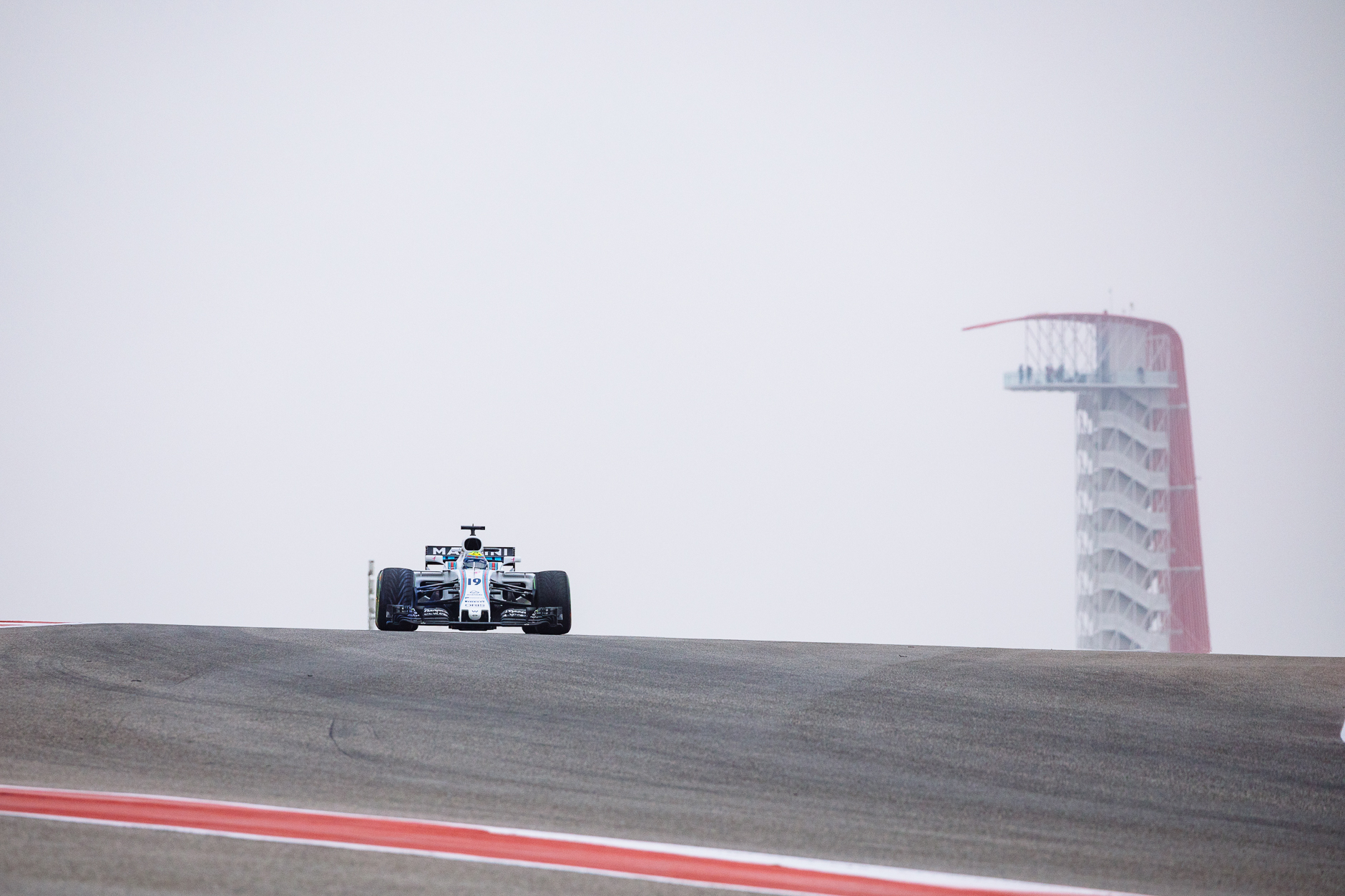 Williams-Martini's Felipe Massa crests the hill at turn 10 during FP1.