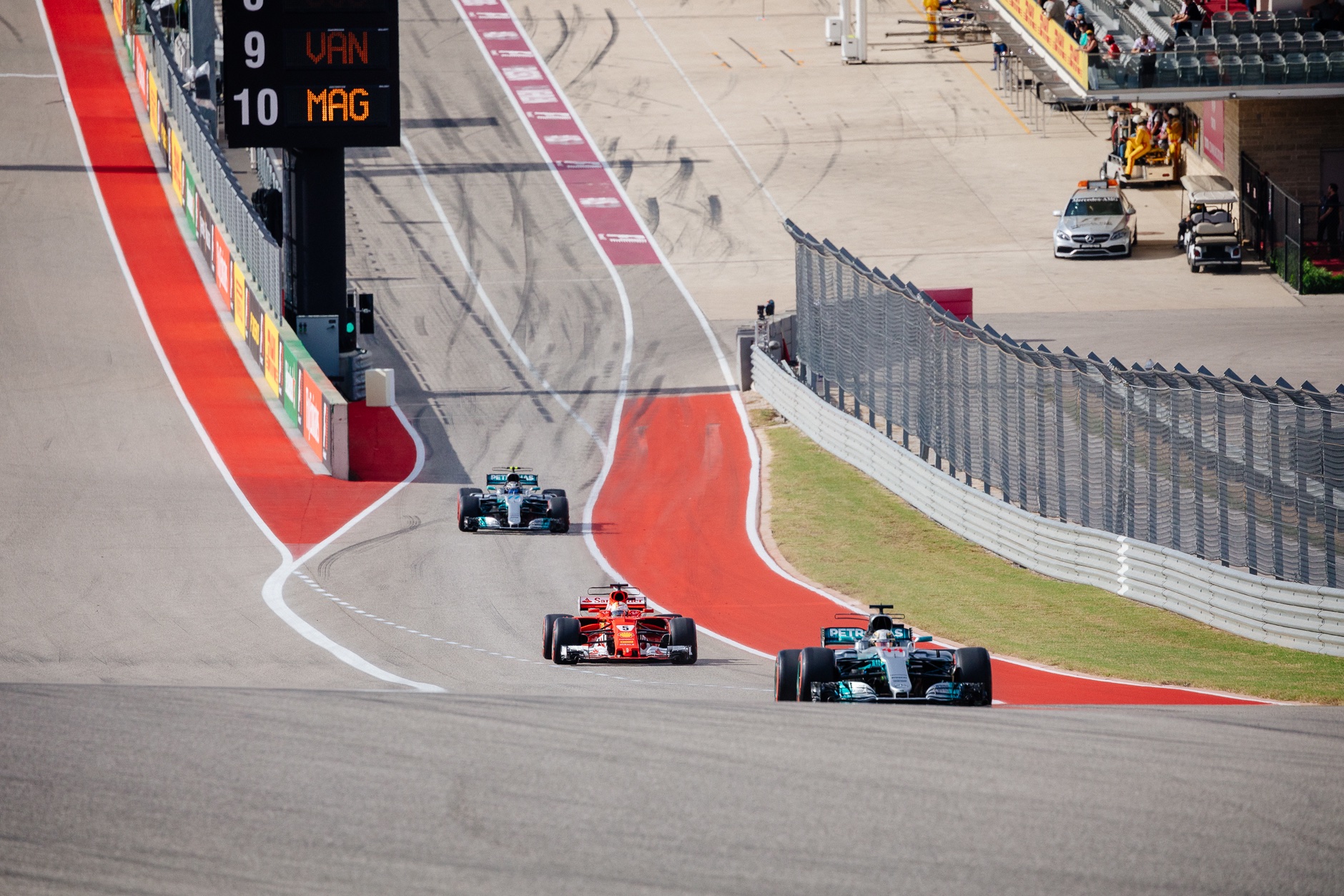 Lewis Hamilton, Sebastian Vettel, and Valtteri Bottas exist pit row to begin their qualifying session.