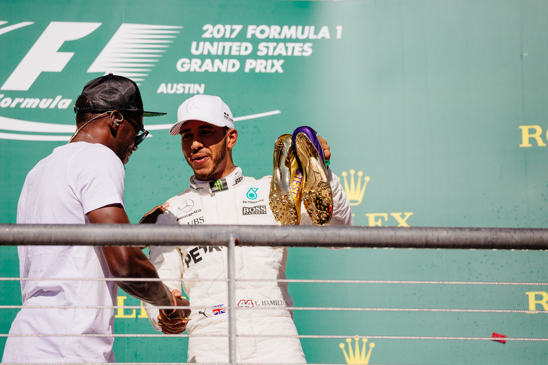Olympian Usain Bolt of Jamaica served as the honorary starter for the race, and conducted the post-race podium interviews while presenting winner Lewis Hamilton with a pair of golden shoes.