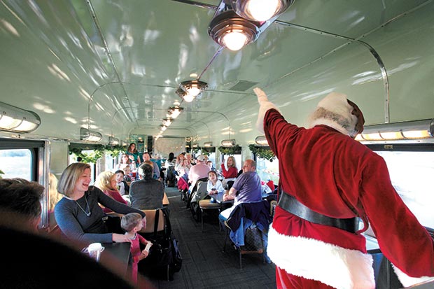 Holiday-themed festivities on board the North Pole Flyer include visits from Santa and Mrs. Claus, Christmas carols, and unlimited hot chocolate.