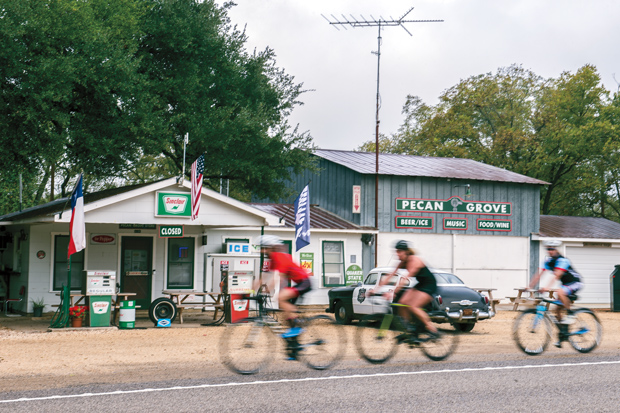 Cyclists pass through Pecan Grove, TX