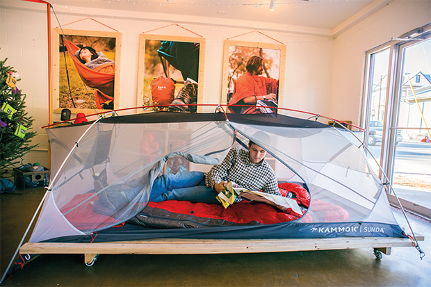 Relaxing in a tent indoors.