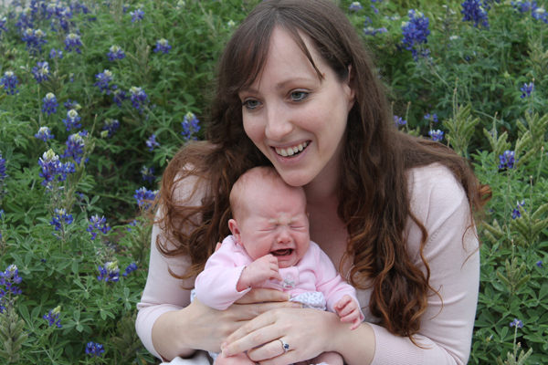 Emily and her 1-month-old baby in bluebonnets in 2013.