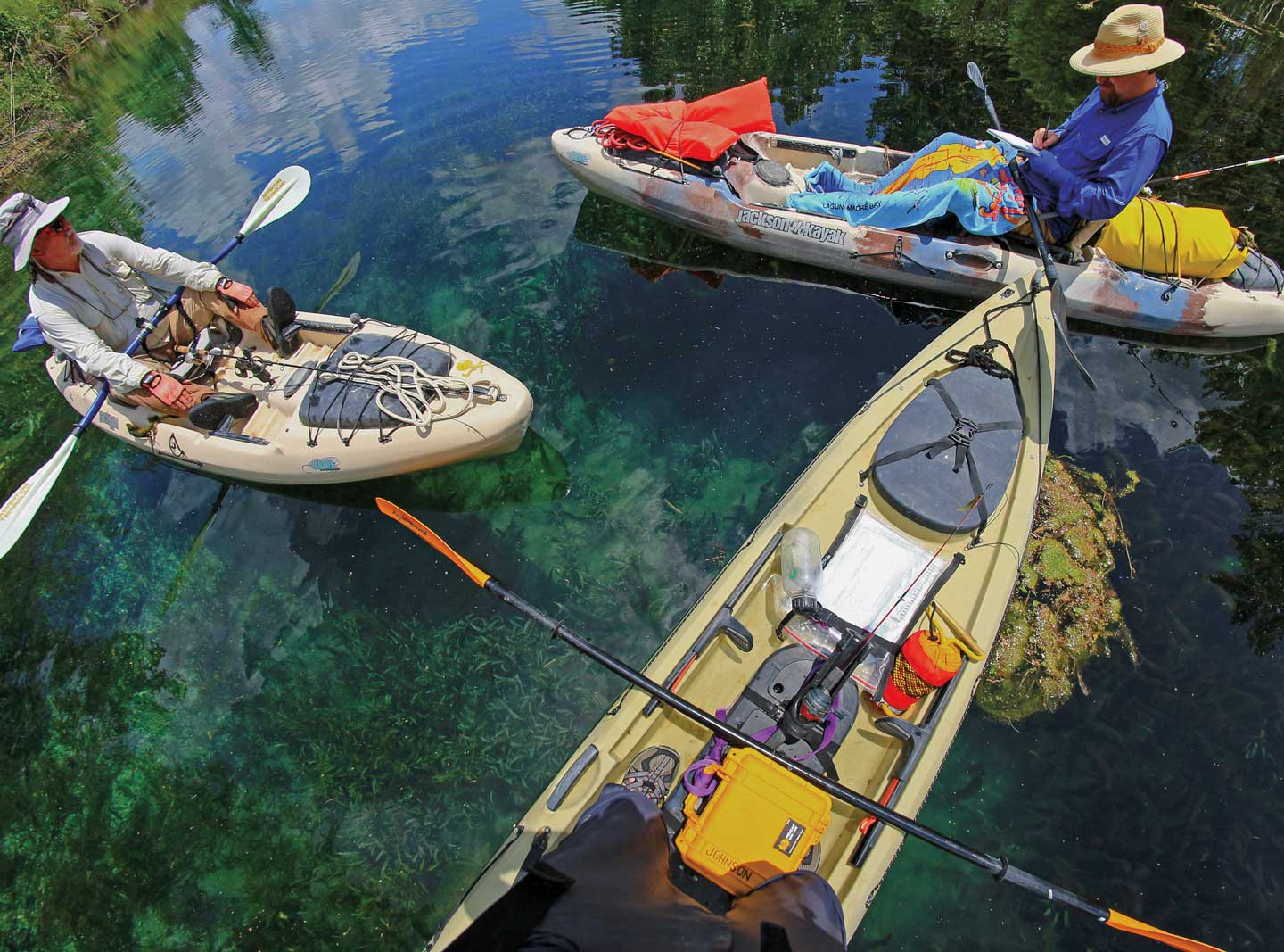 3 kayaks sit in a group on the Devils River