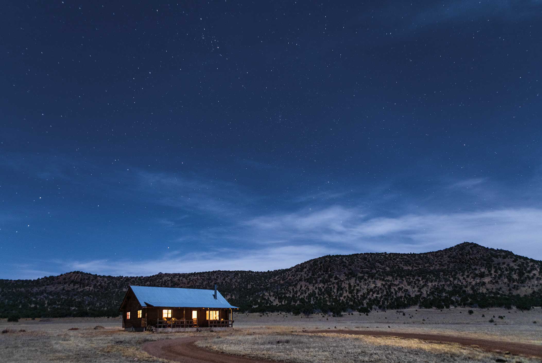 A cabin in front of the Davis Mountains