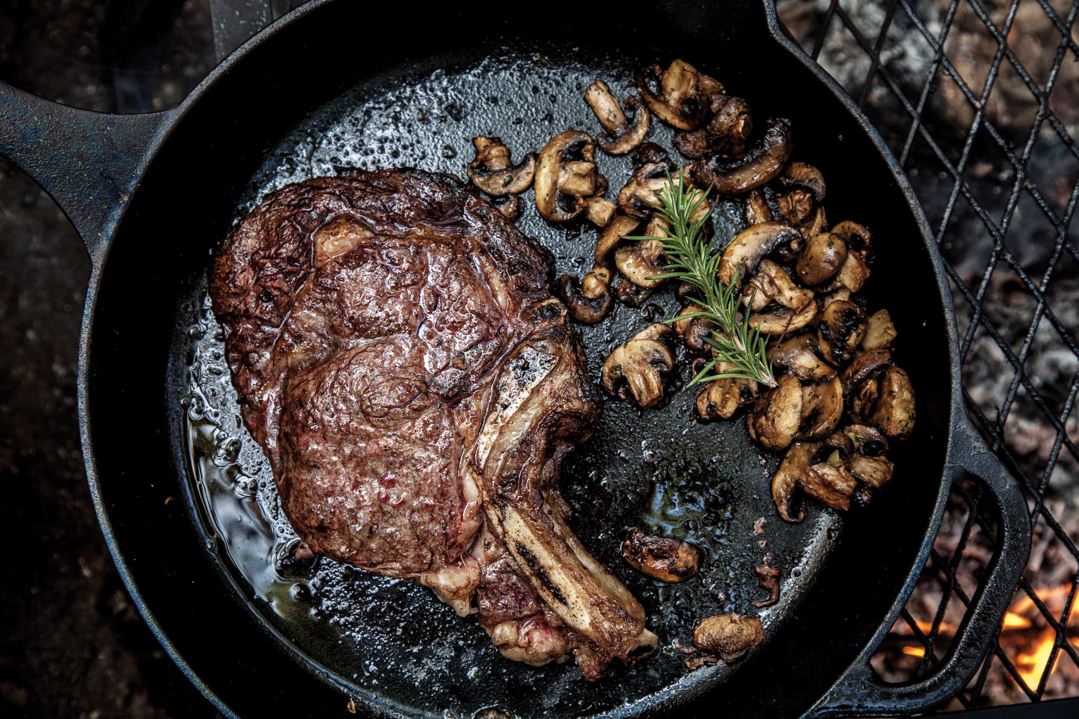 Steak and mushrooms in a cast iron skillet