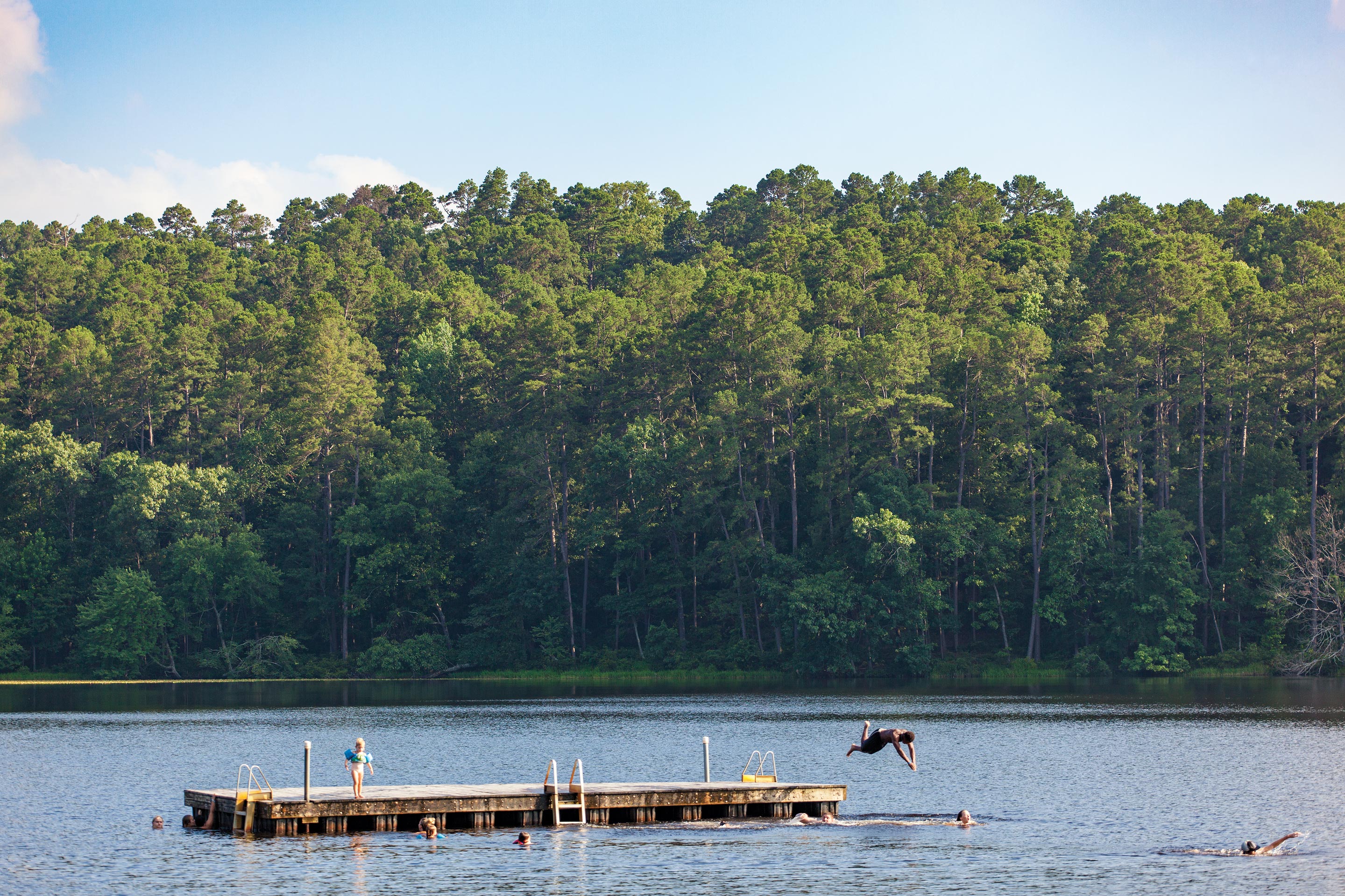 Kids dive into the lake at Daingerfield State Park