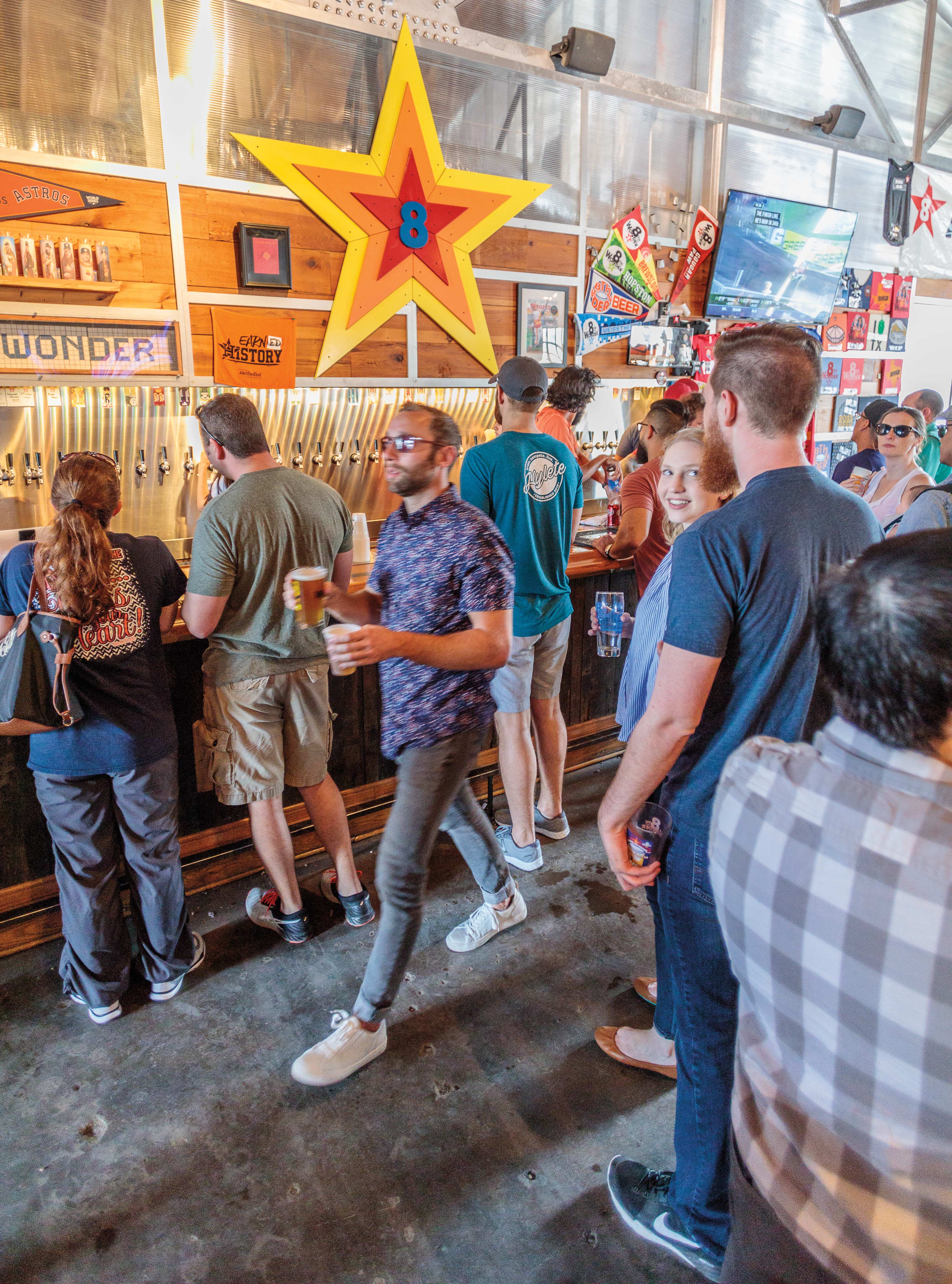 A busy taproom at 8th Wonder Brewing