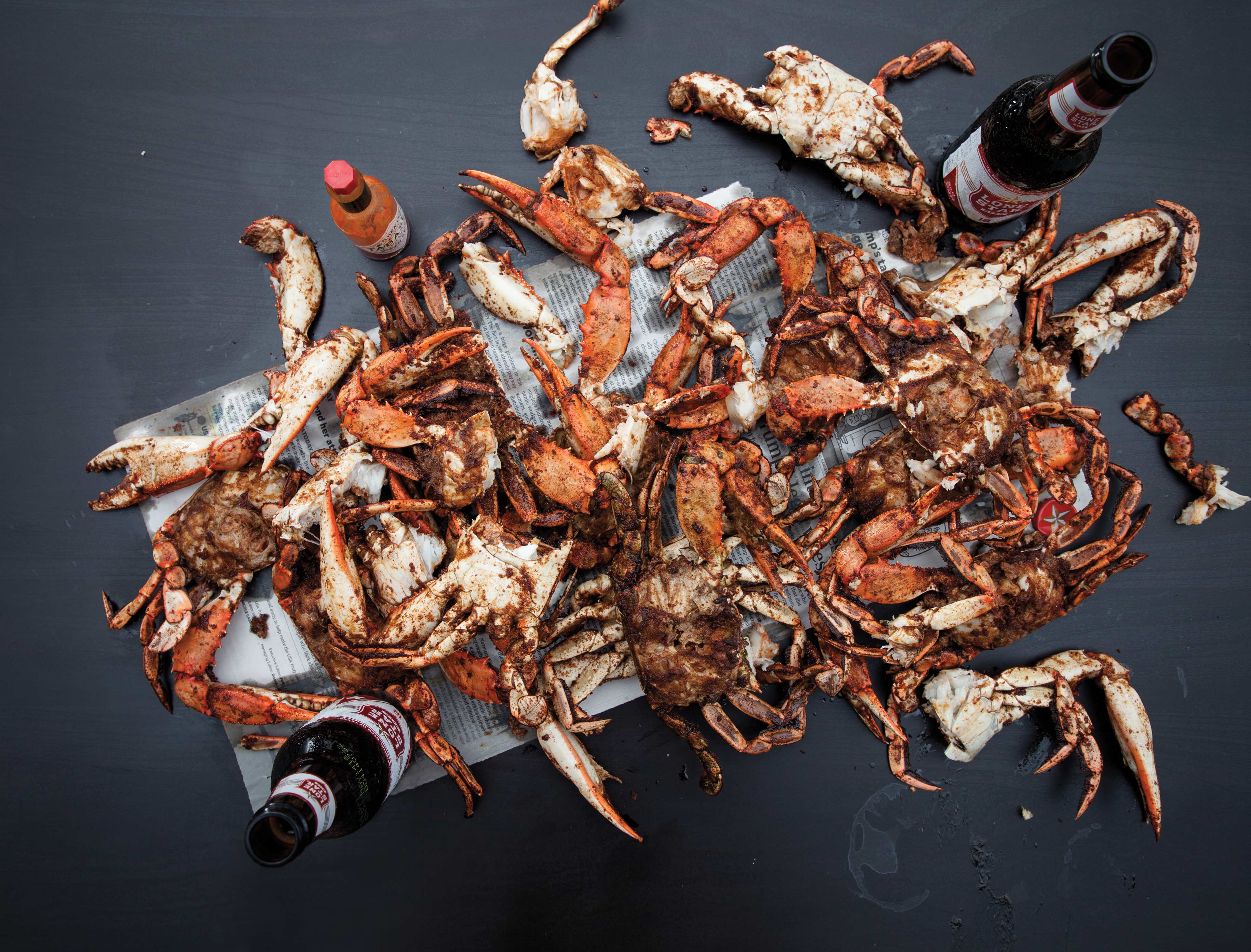A pile of barbecued crab on a table