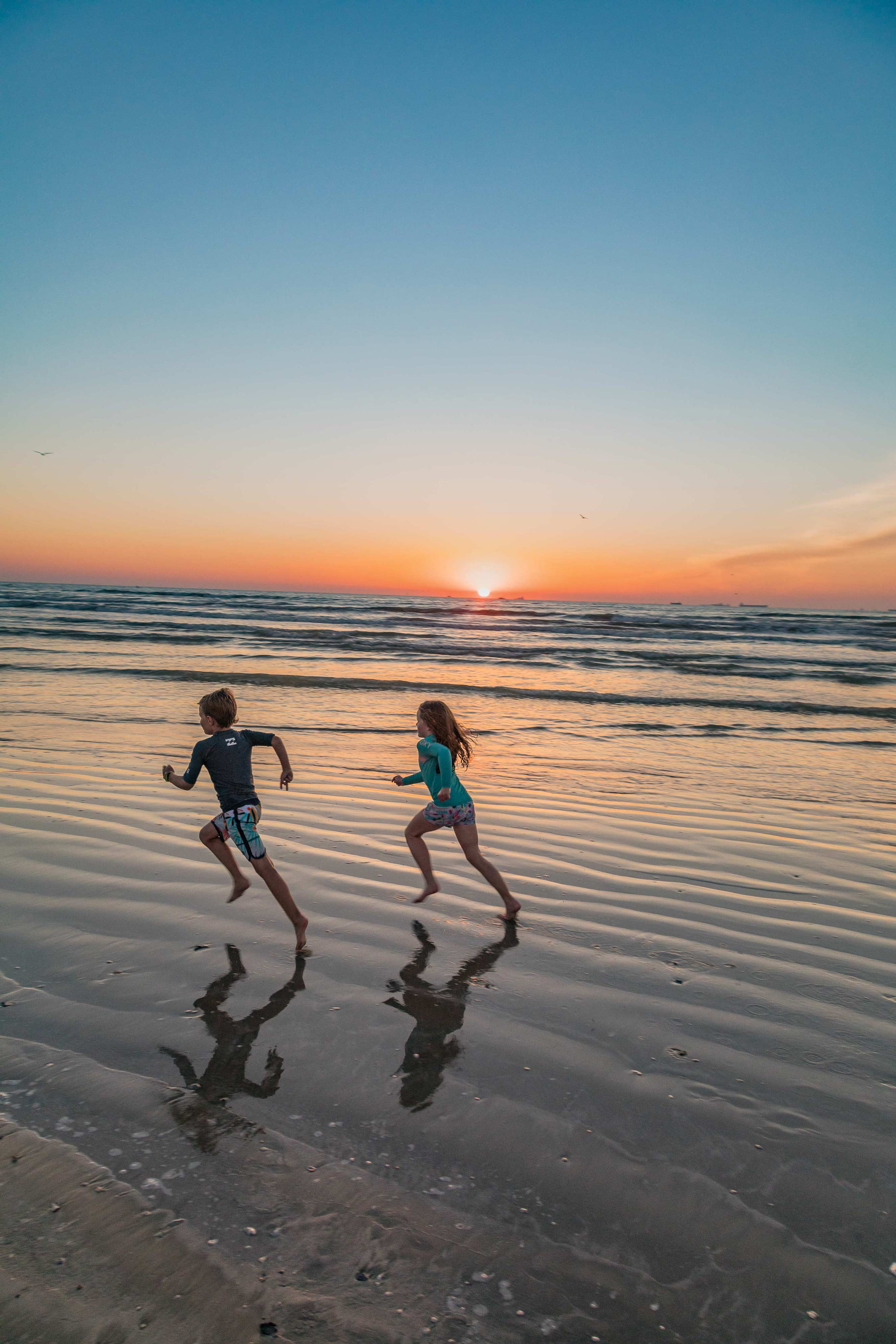 With miles of undeveloped shoreline, San José Island offers room to roam. Kids running on the beach on St. Jo