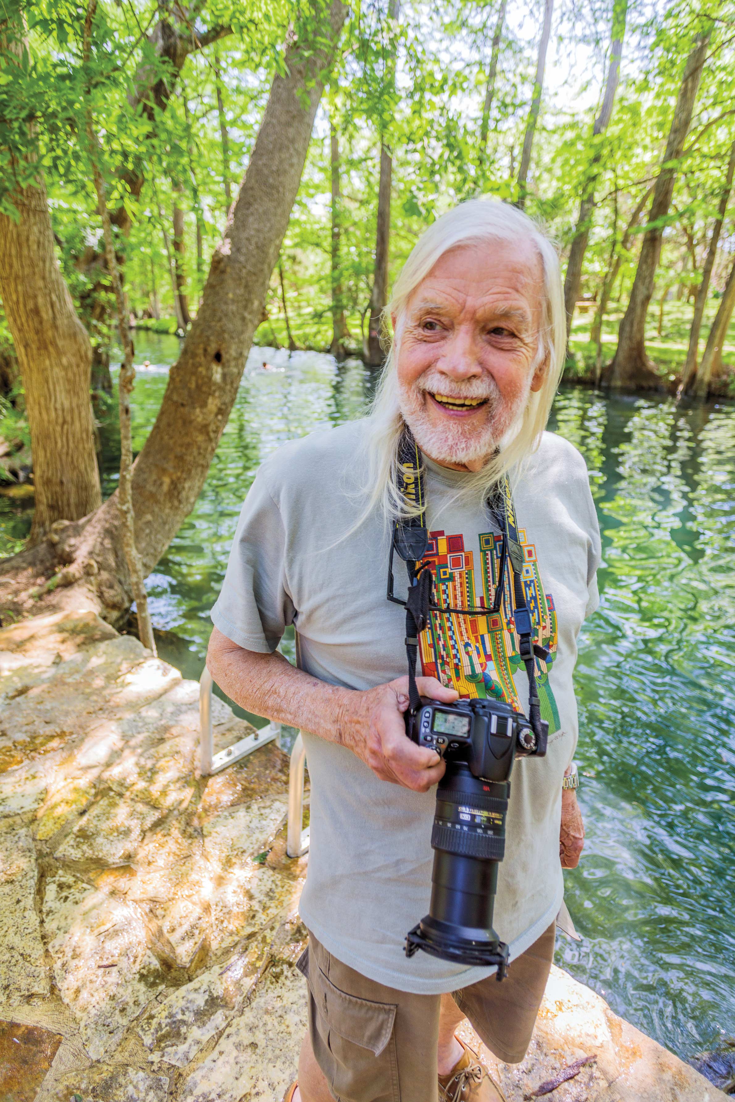 Herb Smith holding his camera at Blue Hole