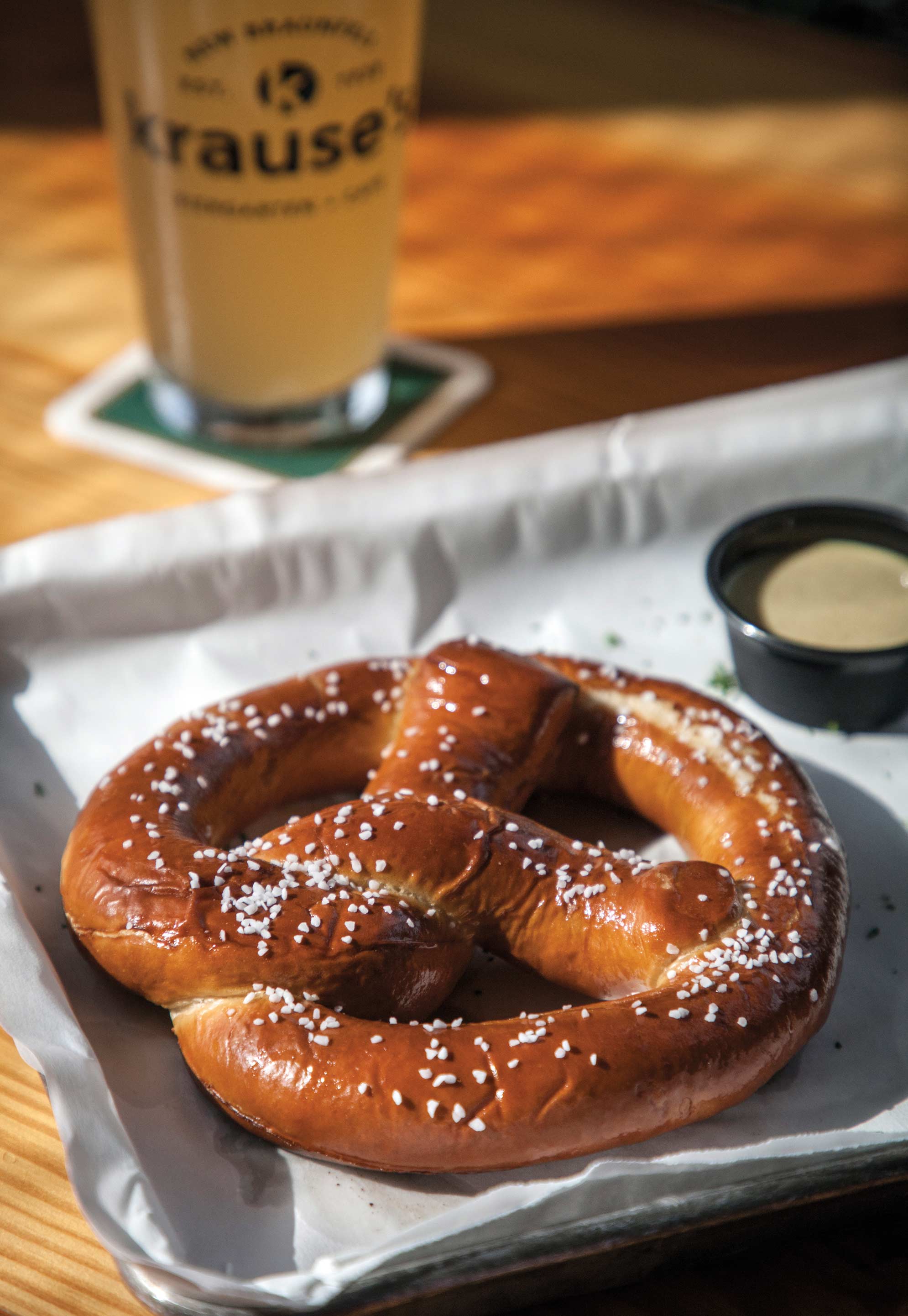 A giant pretzel sits on a tray