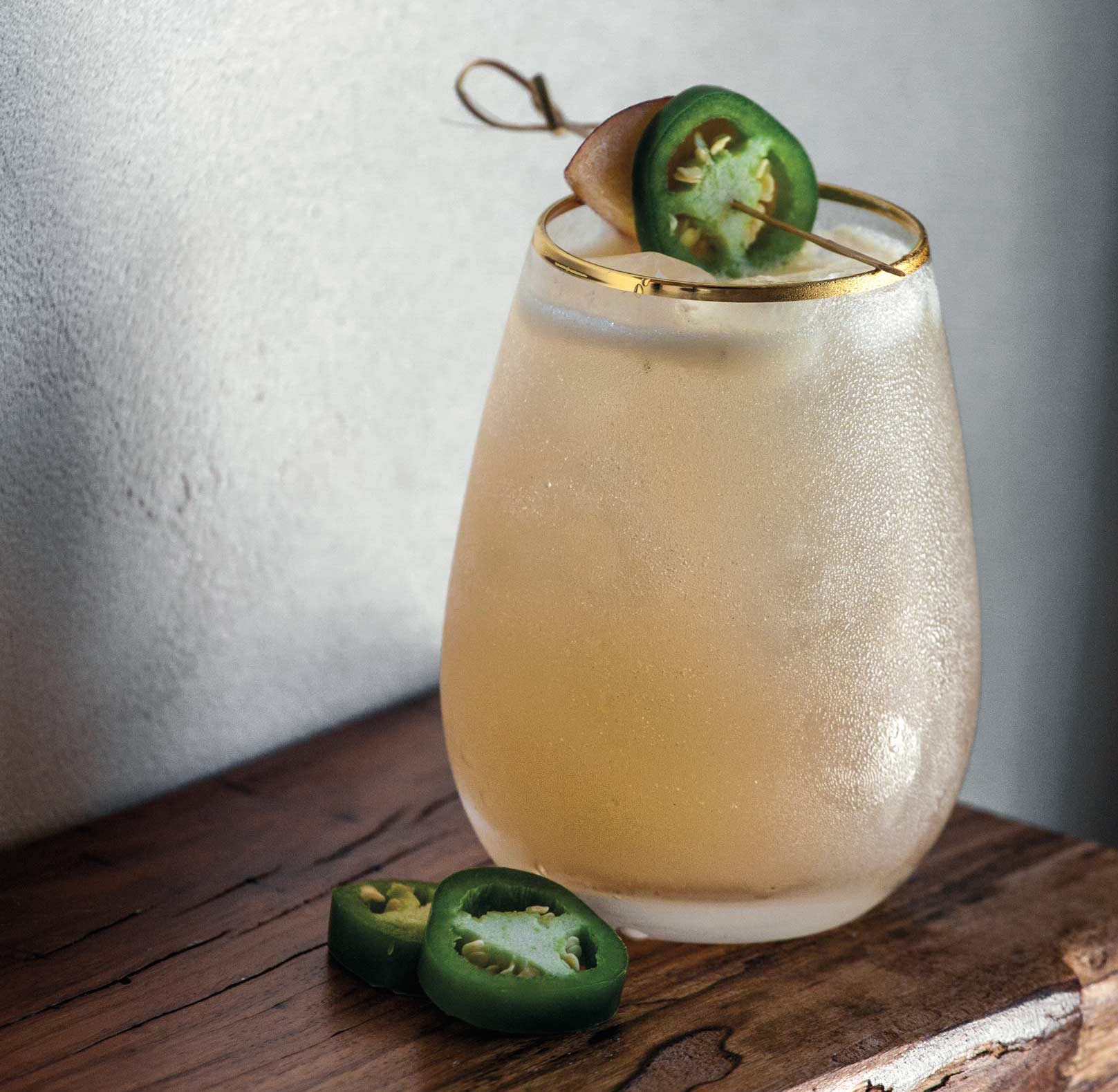 A sotol margarita rests on the bar