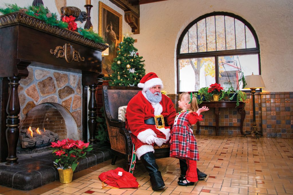 Santa with a young girl at the Holland Hotel