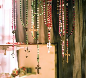 Rosaries hang in a shop
