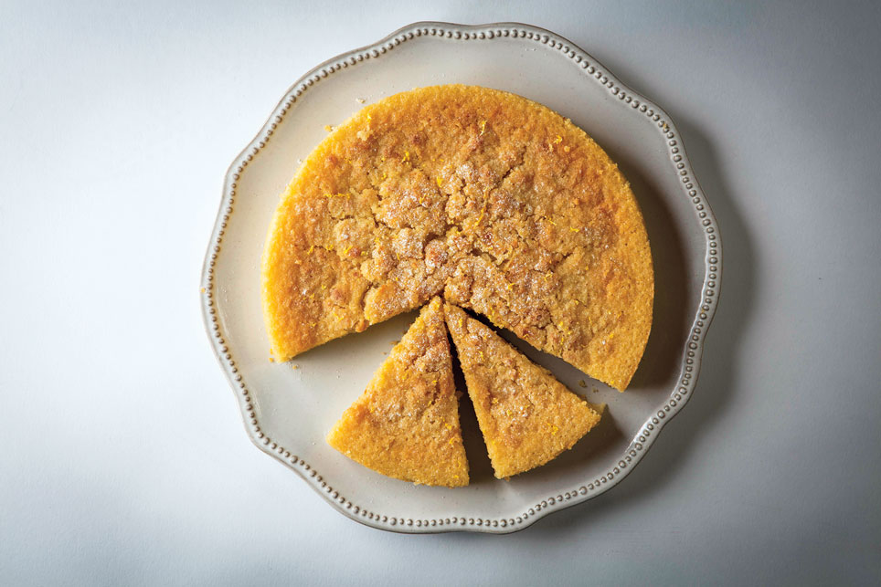 A lemon olive oil cake on a plate