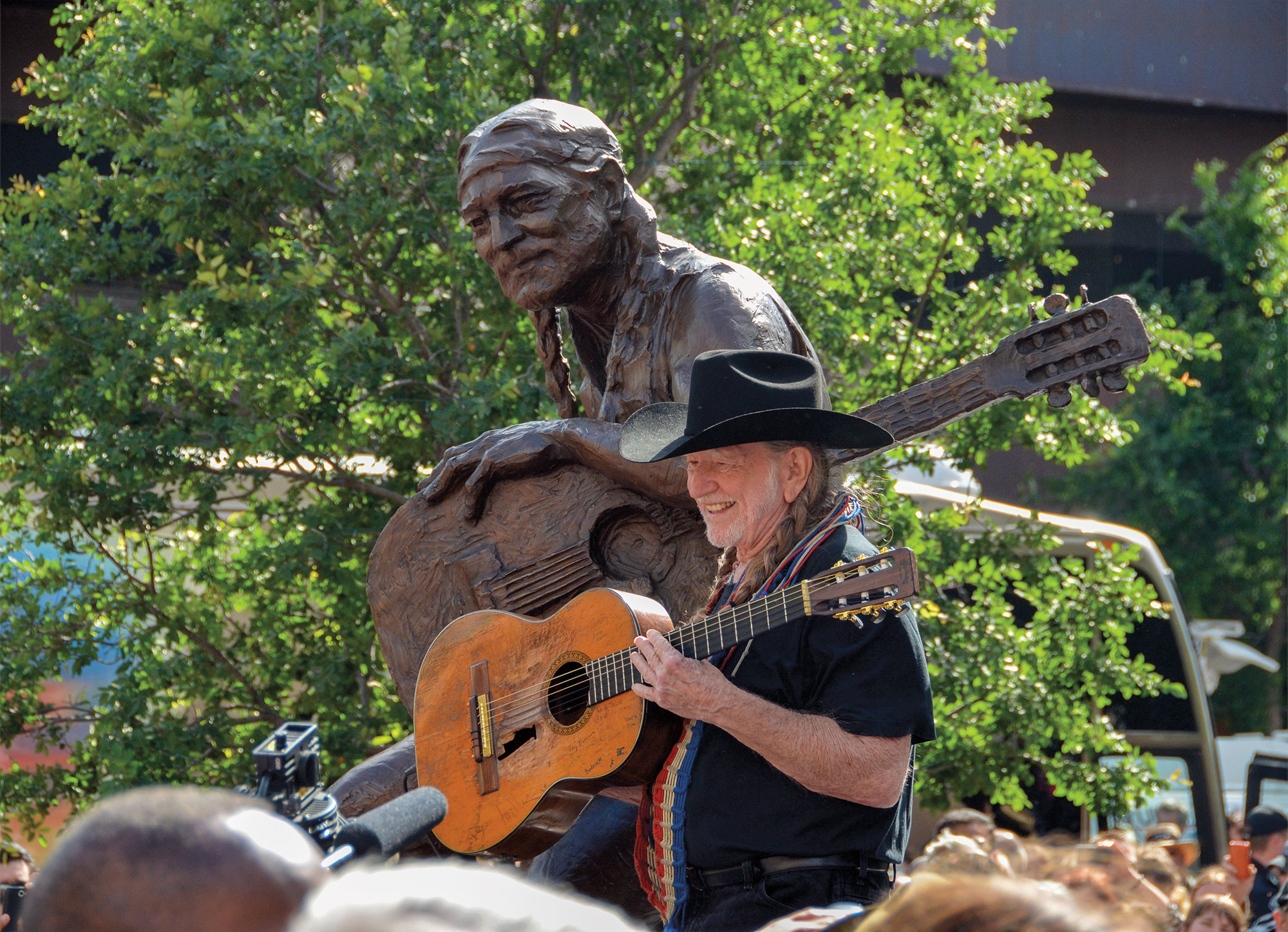 Willie in front of his statue at Austin City Limits. Photo: Turk Pipkin
