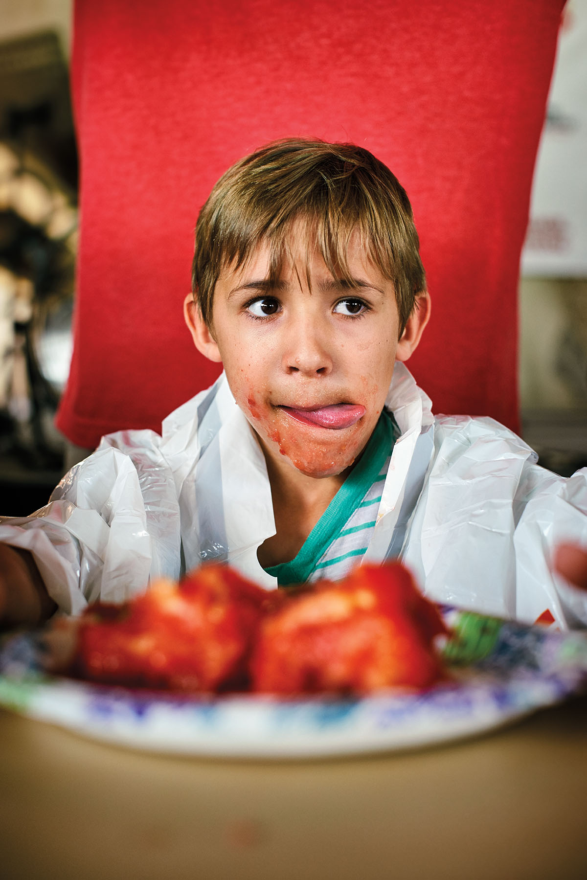 A young man participating in the Jacksonville Tomato Fest tomato eating contest