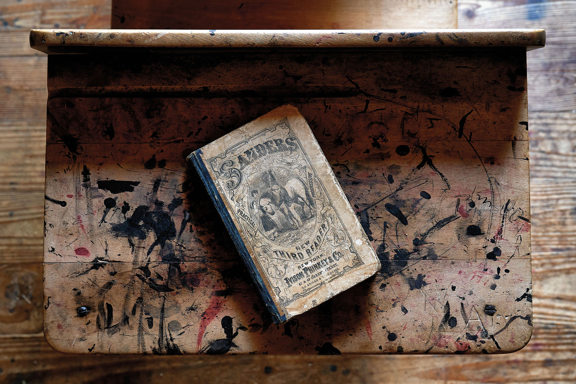 A copy of Sanders Third Readaer, an early American textbook, on display at Millard's Crossing in Nacogdoches, Texas