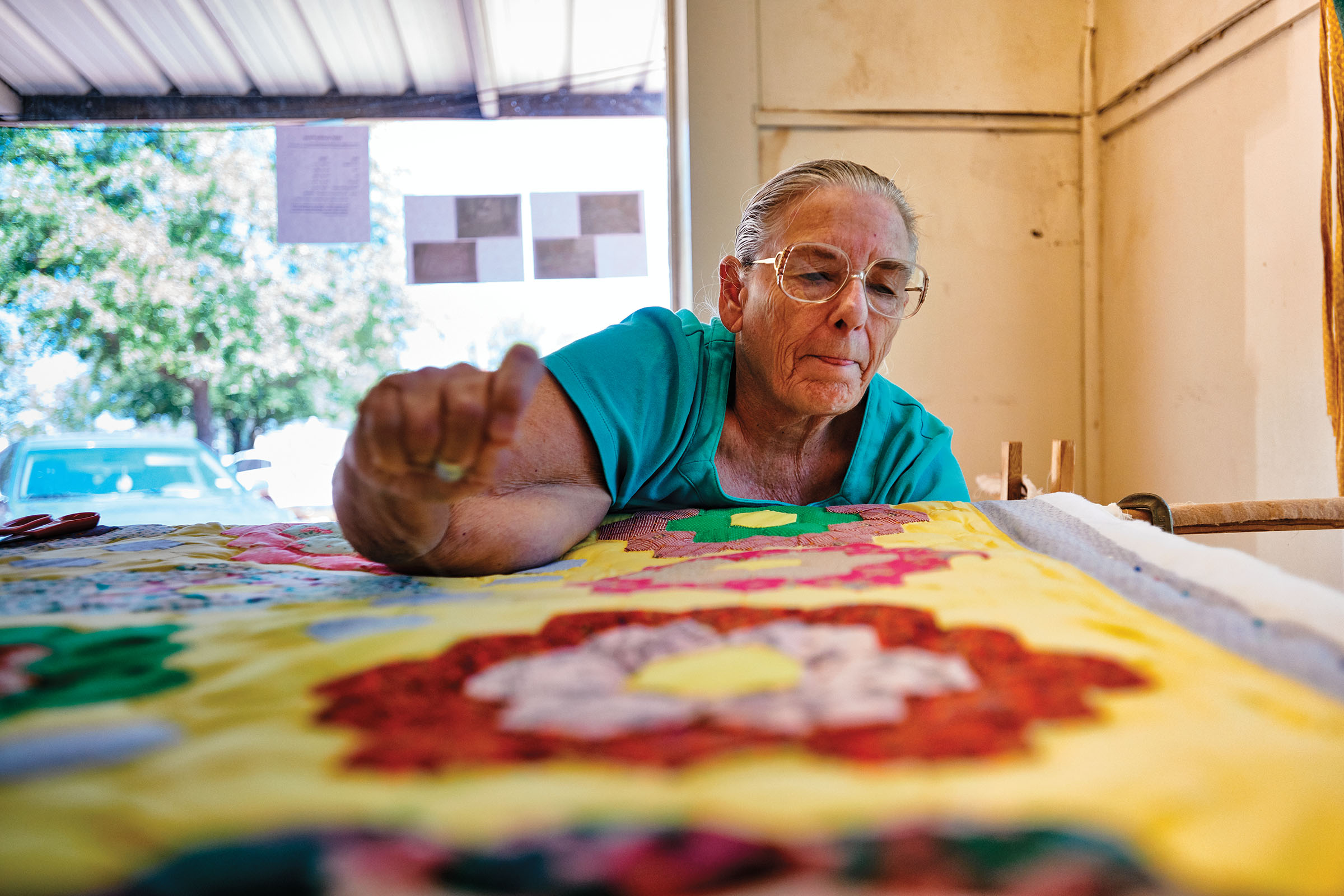 A quilter works on a project for the Retired Senior Volunteer Program in Timpson
