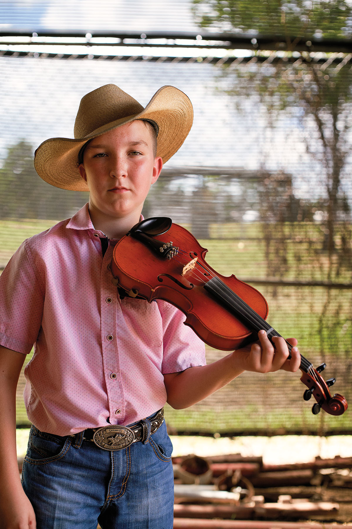 A young man competes at the World Championship Fiddlers' Festival in Crockett, Texas