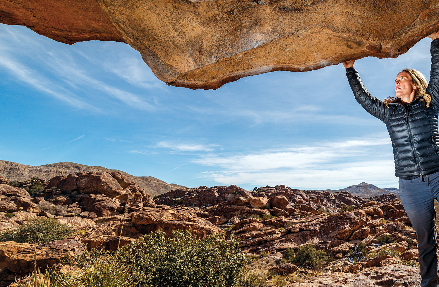 Sarah Hepola on lip of the Moonshine Roof, Hueco Tanks State Park and Historic Site