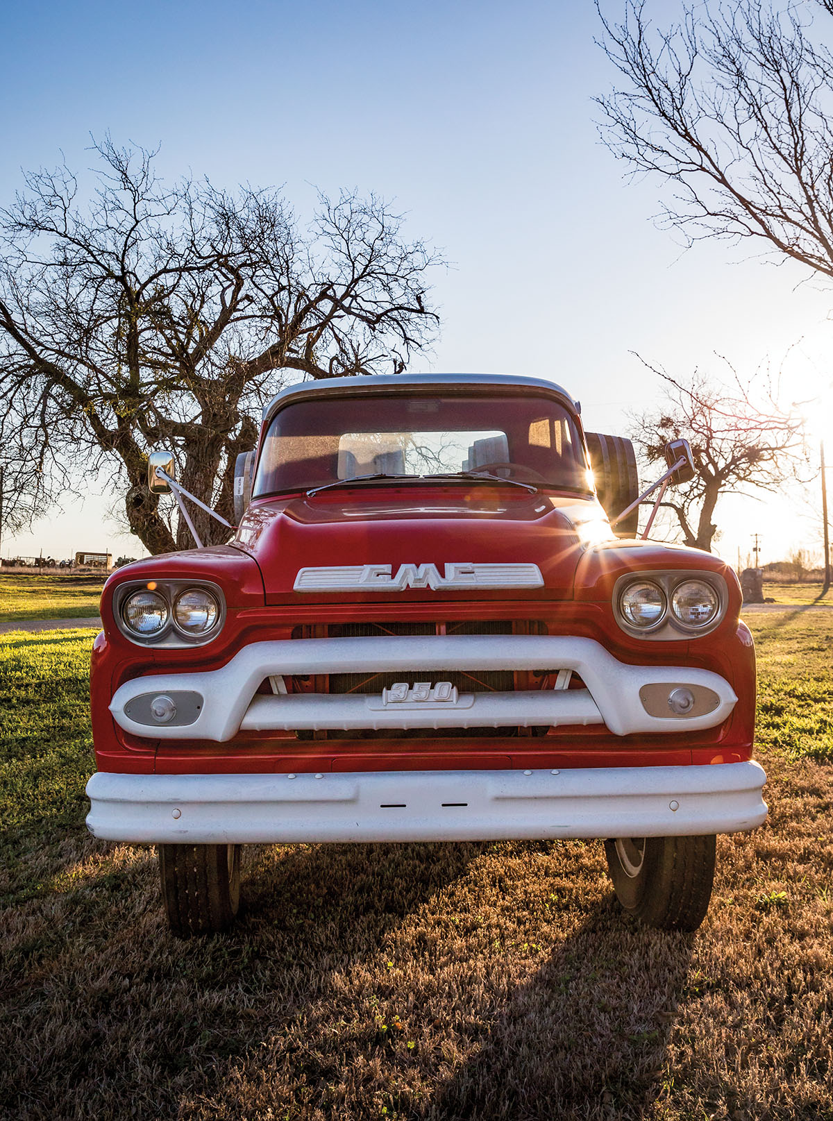 A vintage red truck on the grounds of Slate Mill Wine Collective