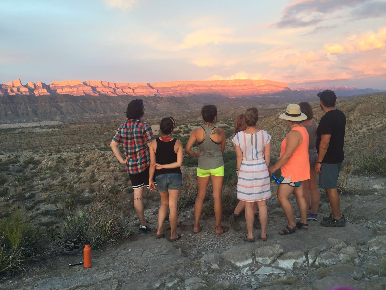 A group of friends looking over a Big Bend sunset.