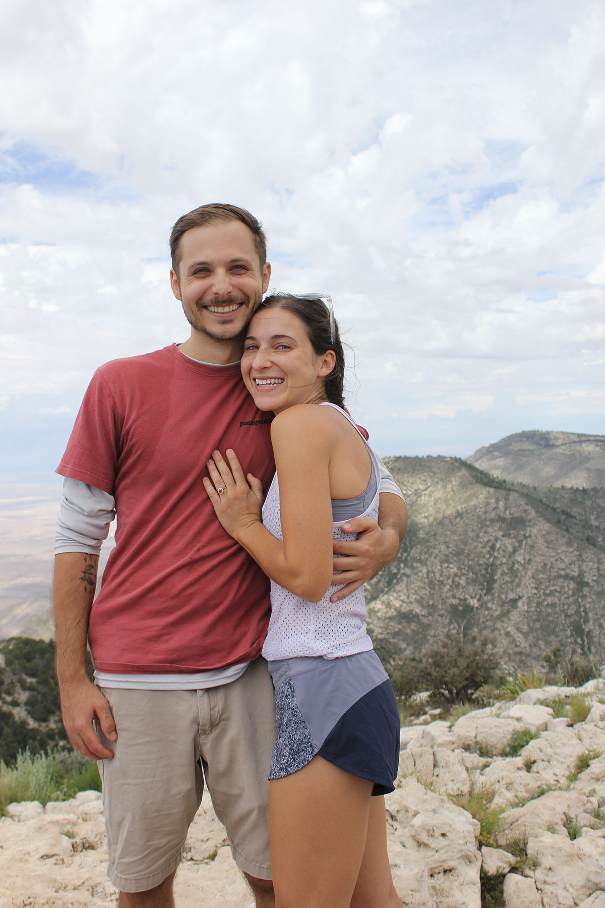 The newly-engaged couple pose at the top of Guadalupe Peak