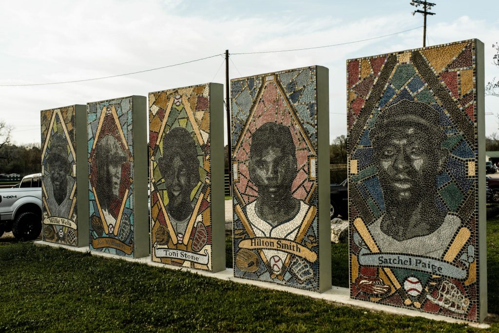 Murals of former Negro League baseball players Satchel Paige, Hilton Smith, Toni Stone, “Smokey” Joe Williams, and Willie Wells located at Downs Field in East Austin.