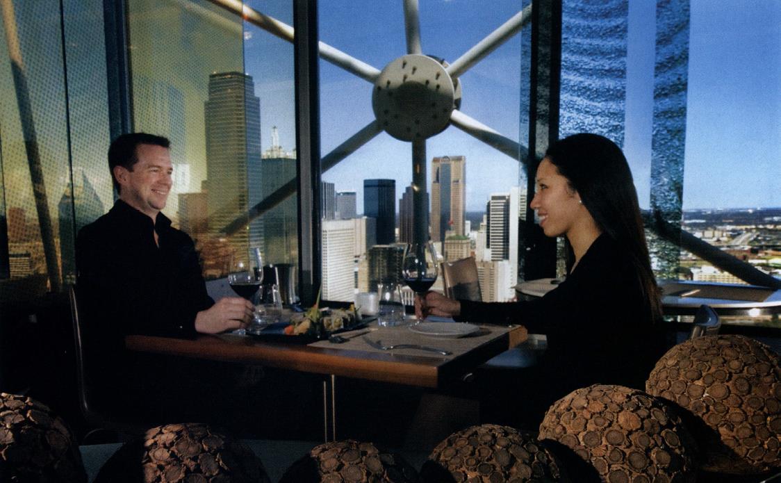 Two people dine near the window at Five Sixty