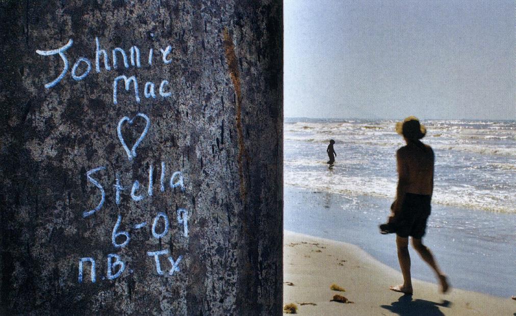 Johnnie Mac hearts Stella is engraved on a post by the shore